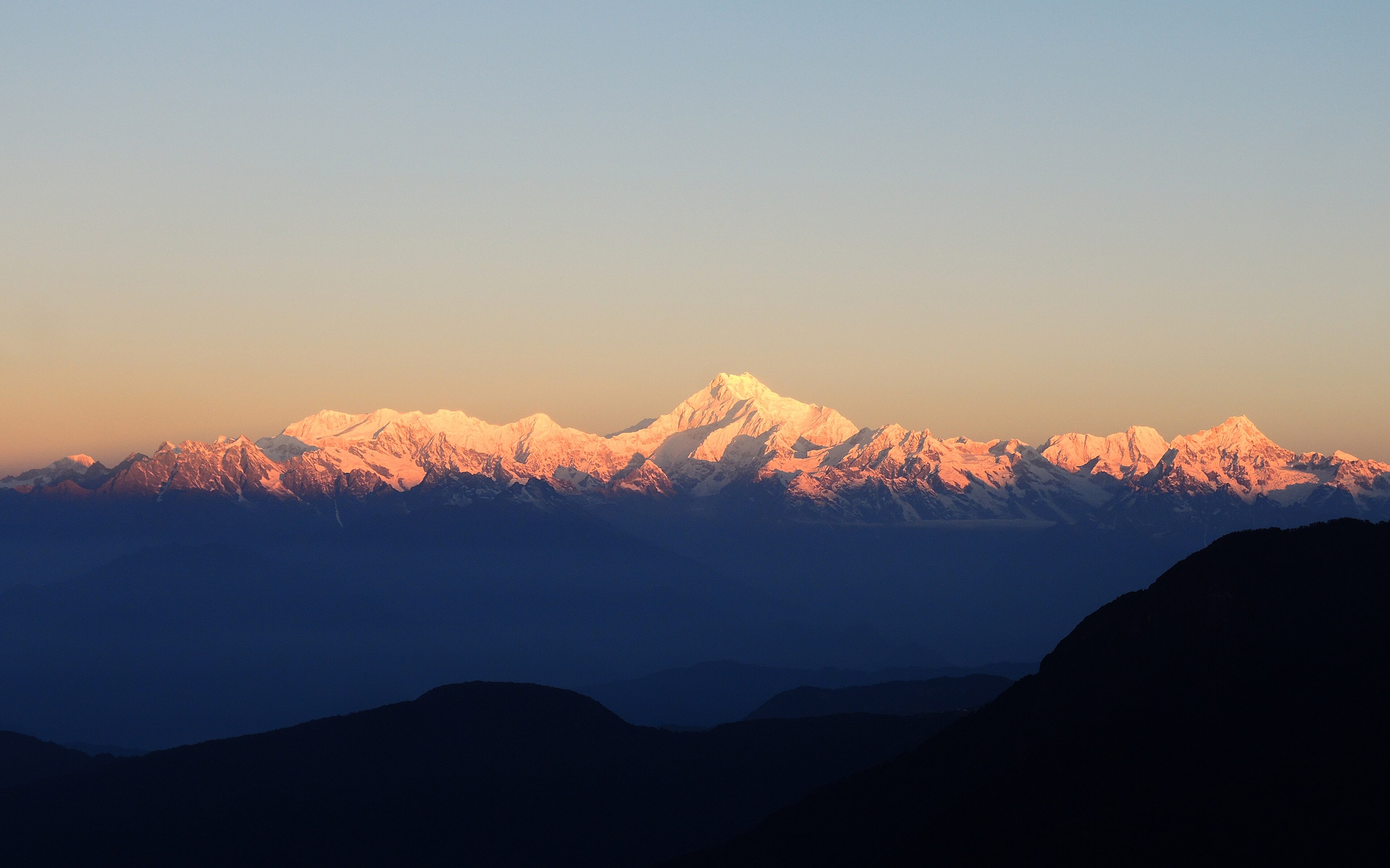 Sun breaking over a Himalayan ridgeline
